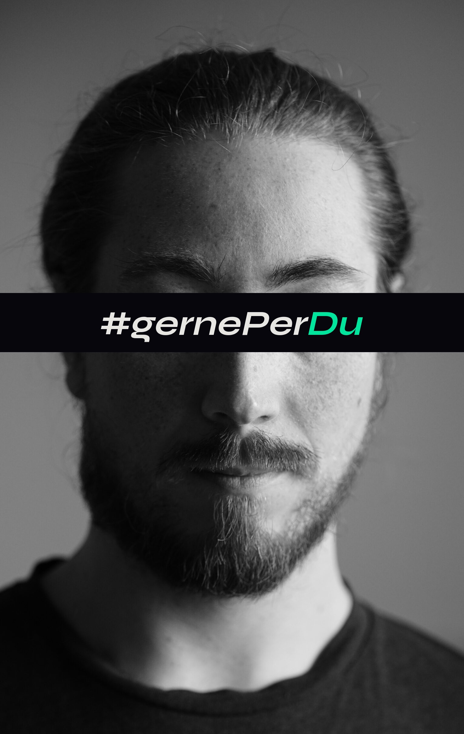Portrait of Danny Lange with a redaction bar reading #gernePerDu over the eyes